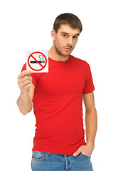 Image showing man in red shirt with no smoking sign