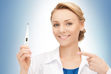 Image showing attractive female doctor with thermometer