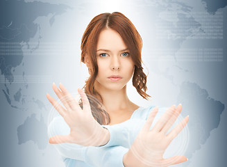 Image showing businesswoman working with touch screen