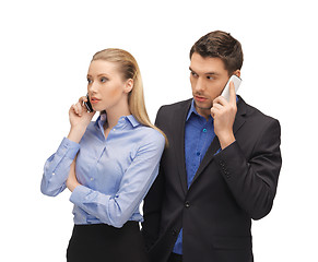 Image showing man and woman with cell phones