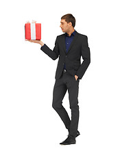 Image showing handsome man in suit with a gift box