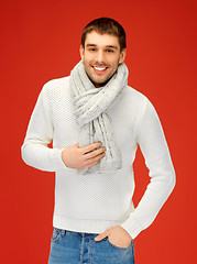 Image showing handsome man in warm sweater and scarf