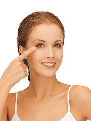 Image showing beautiful woman pointing to eye