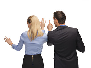 Image showing man and woman working with something imaginary