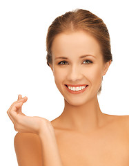 Image showing beautiful woman with moisturizing creme drop