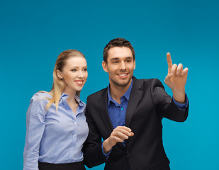 Image showing man and woman working with something imaginary