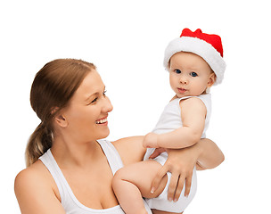 Image showing mother with baby in santa helper hat