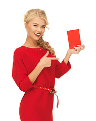 Image showing lovely woman in red dress with note card