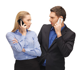 Image showing man and woman with cell phones