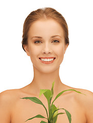 Image showing woman with green sprout