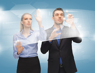 Image showing man and woman working with virtual touch screens