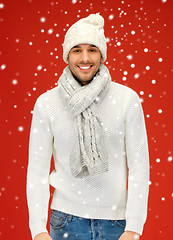 Image showing handsome man in warm sweater, hat and scarf