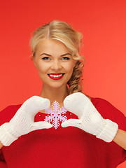 Image showing woman in mittens and red dress with snowflake