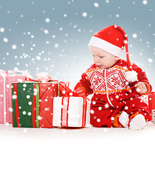 Image showing santa helper baby with christmas gifts