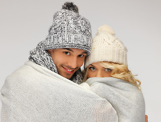 Image showing family couple under warm blanket