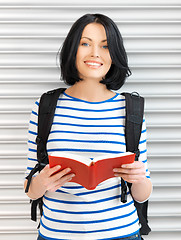 Image showing woman with bag and book
