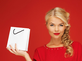 Image showing lovely woman in red dress with shopping bag