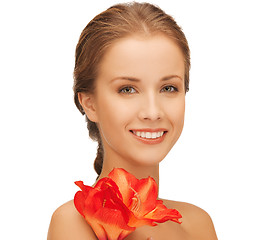 Image showing lovely woman with red lily flower