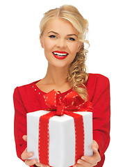 Image showing lovely woman in red dress with present