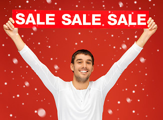 Image showing handsome man with sale sign