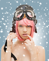 Image showing pink hair girl in aviator helmet with snow