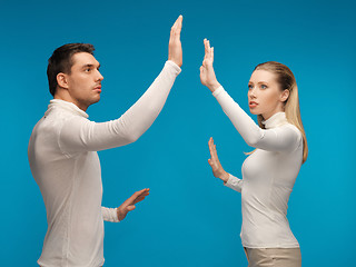 Image showing man and woman working with something imaginary