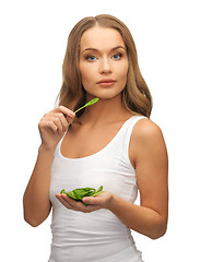 Image showing woman with spinach leaves on palms