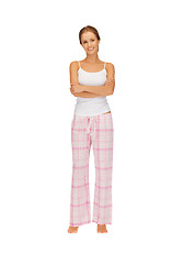 Image showing happy and smiling woman in cotton pajamas