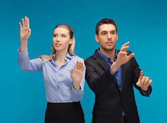 Image showing man and woman working with something imaginary