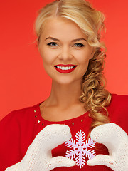 Image showing woman in mittens and red dress with snowflake