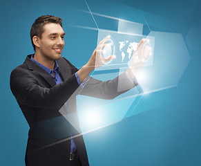 Image showing man in suit working with virtual screens