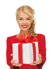 Image showing lovely woman in red dress with present