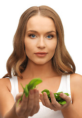 Image showing woman with spinach leaves on palms