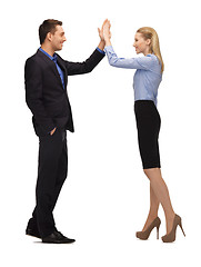 Image showing man and woman giving a high five