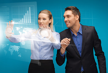 Image showing man and woman working with virtual touch screens