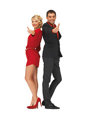 Image showing handsome man and lovely woman showing thumbs up