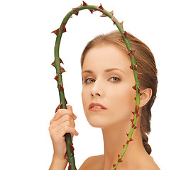 Image showing woman holding branch with thorns