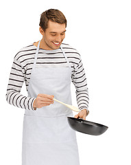 Image showing handsome man with pan and spoon