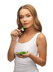 Image showing woman with spinach leaves on palms