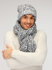 Image showing handsome man in warm sweater, hat and scarf