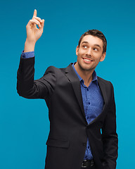 Image showing man in suit with his finger up