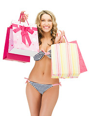 Image showing seductive woman in bikini with shopping bags