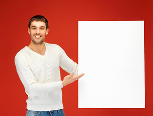 Image showing handsome man with big blank board