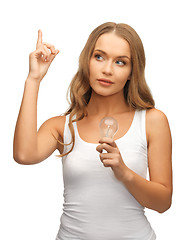 Image showing woman with energy saving bulb