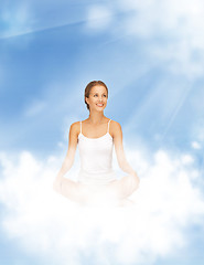 Image showing woman practicing yoga lotus pose