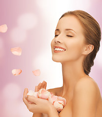 Image showing beautiful woman with rose petals