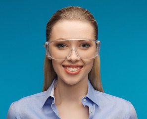 Image showing businesswoman in protective glasses