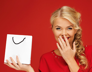 Image showing lovely woman in red dress with shopping bag