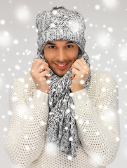 Image showing handsome man in warm sweater, hat and scarf