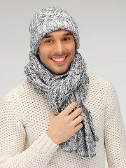 Image showing handsome man in warm sweater, hat and scarf